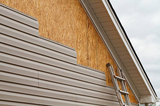 Professional Emergency Siding Repair technician working in Madison, PA